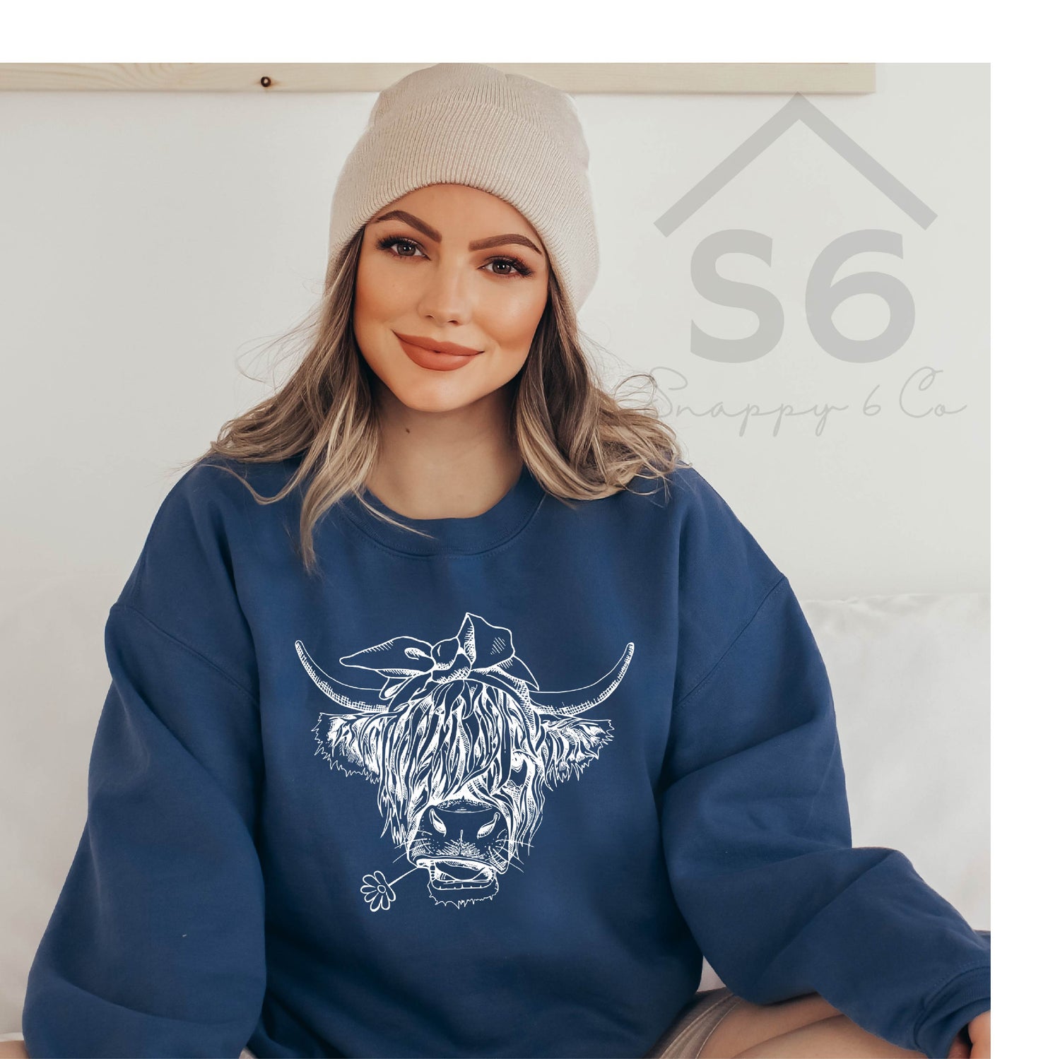 Indigo blue crewneck sweatshirt with white highland cow