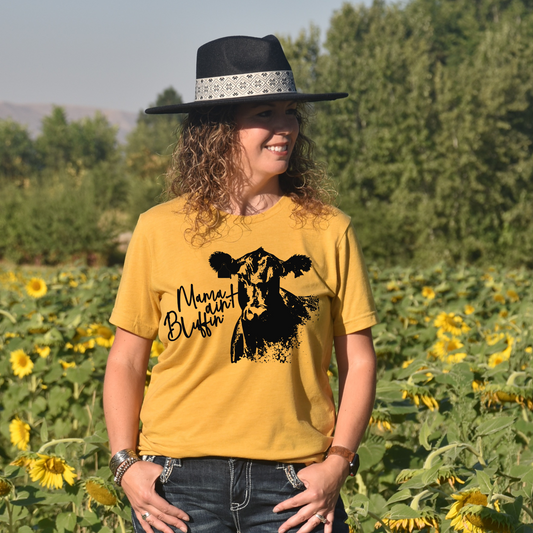 woman wearing a t-shirt with a cow on it and it says mama ain't bluffing